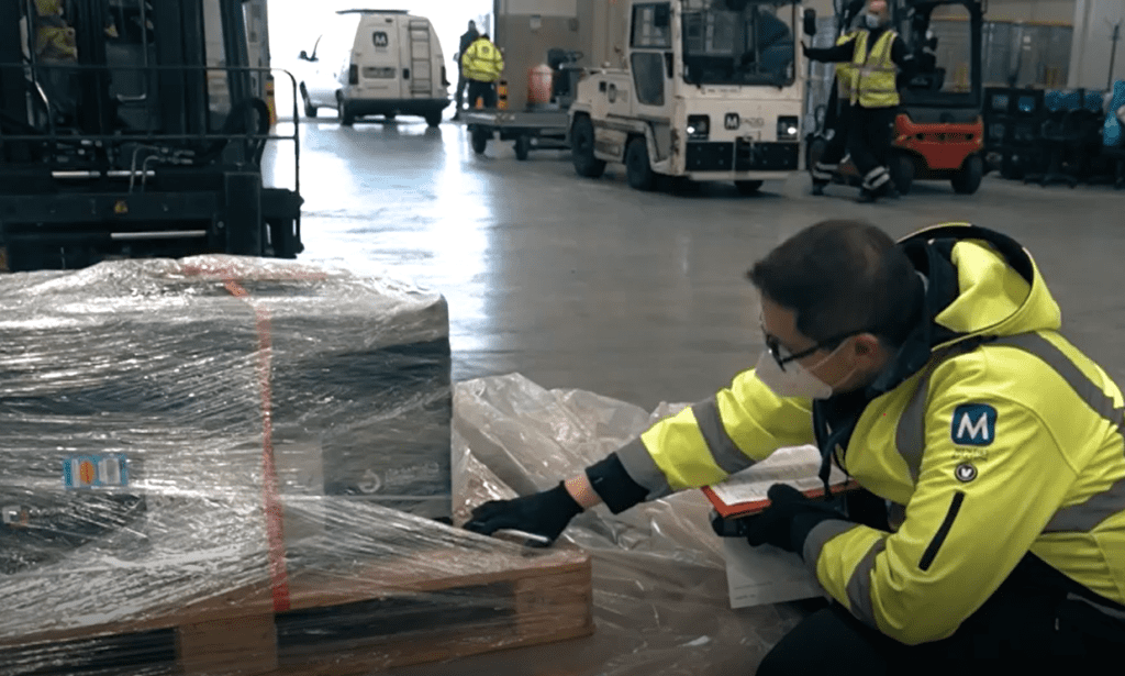 Baggage handling crew taking care of vaccine transportation v2