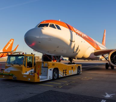 EasyJet aircraft being pushed back by the electric ground support tug, TaxiBot on the apron.