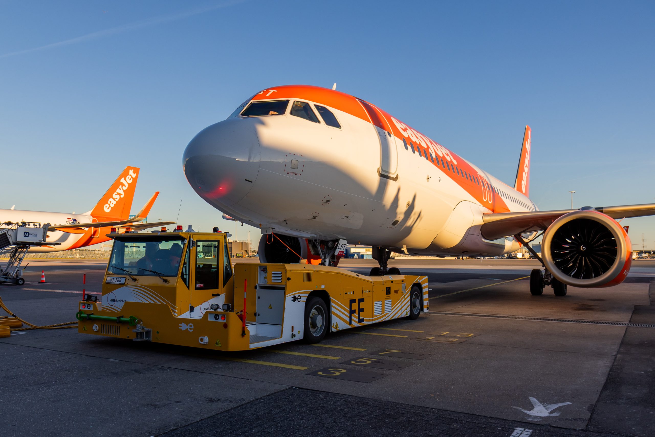 EasyJet aircraft being pushed back by the electric ground support tug, TaxiBot on the apron.