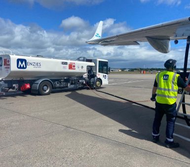 Menzies Aviation fuelling operator refuelling a KLM aircraft on the airport apron.