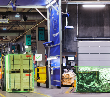 Automated cargo measurement and scanning portal inside a cargo facility at Heathrow Airport.