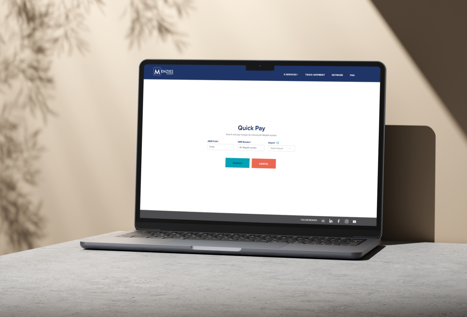 Menzies Aviation Quick Pay webpage displayed on a laptop screen.