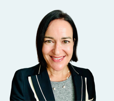 Professional headshot of a Menzies Aviation executive against a light grey background.