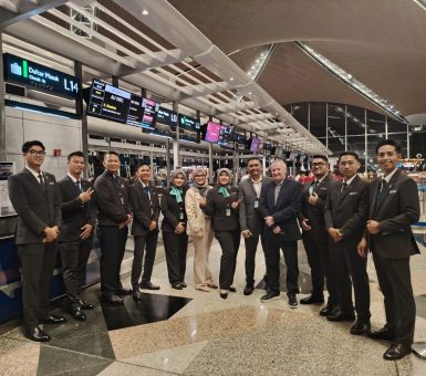 Menzies Aviation passenger services team gathered at check-in counters at Kuala Lumpur International Airport.